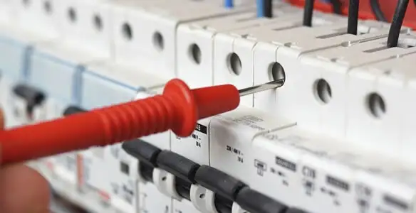 Electrical contractor testing circuit breakers during electrical repair in Biggs, CA