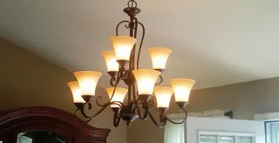 Classic ceiling chandelier installation with warm lighting in Chico, CA