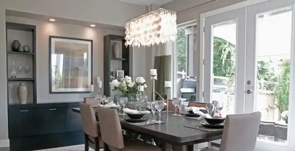 Elegant dining room chandelier installation above table in Chico, CA