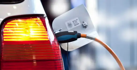 Electric car plugged into EV charger after professional installation in Chico, CA