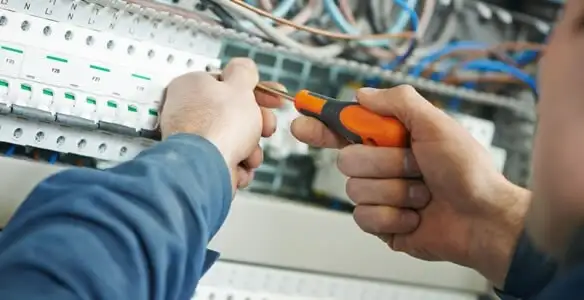 electrical service showing licensed electrician performing electrical panel maintenance and adjustments in Chico, CA