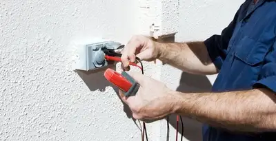 Electrician performing home electrical outlet and wiring inspection in Chico, CA