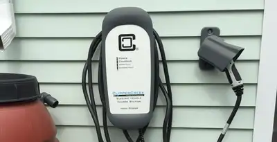 Outdoor electric vehicle charger installation on residential wall in Chico, CA
