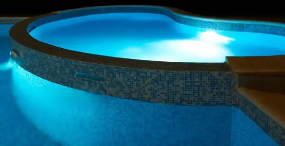 pool light installation and repair services highlighting illuminated pool interior lighting in Chico, CA