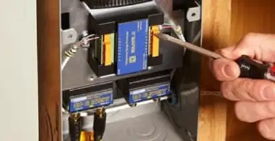 Whole home surge protection device being installed by a licensed electrician to protect electrical systems in Chico, CA